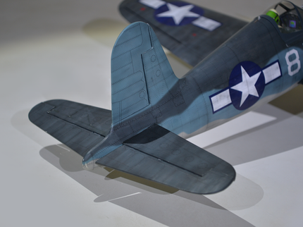 Phoenix Model F4U Corsair 59'' W/Electric Retract Model airplane with a blue and gray color scheme on a light background