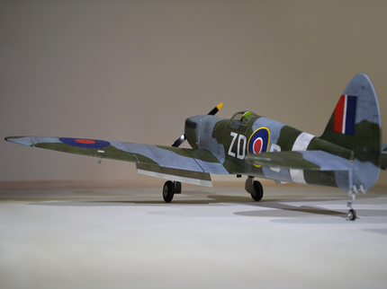 Phoenix Model Spitfire 55" W/Electric Retract Model of a vintage airplane with British flags on a neutral background