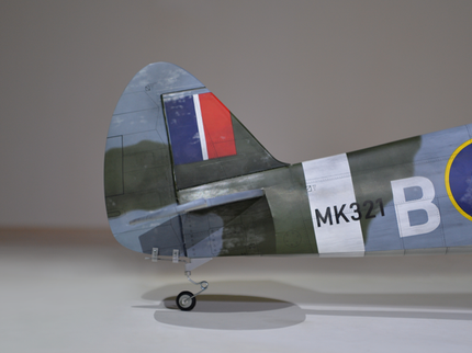 Phoenix Model Spitfire 55" W/Electric Retract Model airplane tail fin with British flag and 'B' marking on a plain background
