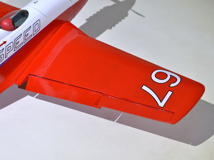 Phoenix Model STREGA 56'' W/Electric Retract Close-up of a red airplane wing with 'Speed' branding on a white background