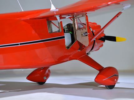 Phoenix Model STINSON RELIANT 68" ARF model airplane with a black stripe on a white background