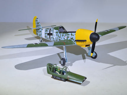 Phoenix Model MESSERCHMITT Bf 109 72'' W/Electric Retract Model airplane with a yellow nose and camouflage pattern on a gray background