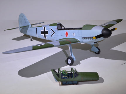 Phoenix Model MESSERCHMITT Bf 109 77'' W/Electric Retract ARF V2 Model airplane and truck on a light gray background