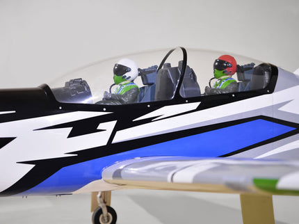 Model of Phoenix Model TUCANO TURBOPROP 103" with a driver figure inside on a white background