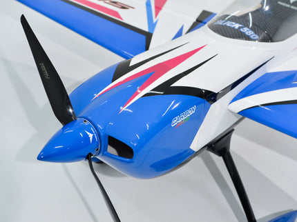 Close-up of Phoenix Model SLICK 580 67" ARF V2 (20-26cc) model airplane with a propeller on a light gray background