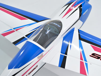 Close-up of Phoenix Model SLICK 580 67" ARF V2 (20-26cc) with blue, red, and white design on a gray background