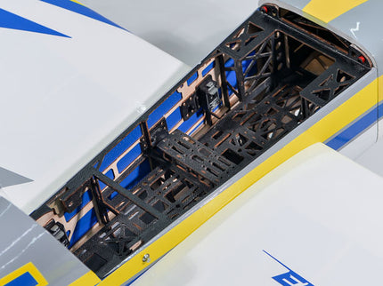 Close-up of Phoenix Model EDGE 540 V3 67'' ARF V2 (20-26cc) model airplane with a detailed black interior structure on a white background.