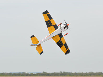 Phoenix Model SBACH 342 74'' ARF V2 Yellow and black airplane flying against a clear sky