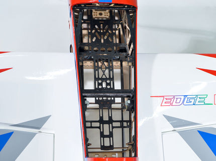 Close-up of a red and white Phoenix Model EDGE 540 V3 60'' with a geometric pattern on a white background