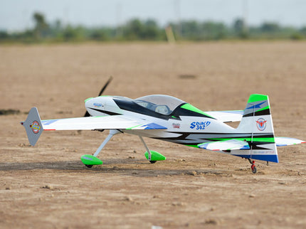 Phoenix Model SBACH 342 60'' ARF V2  Model airplane on a dirt field with blurred background