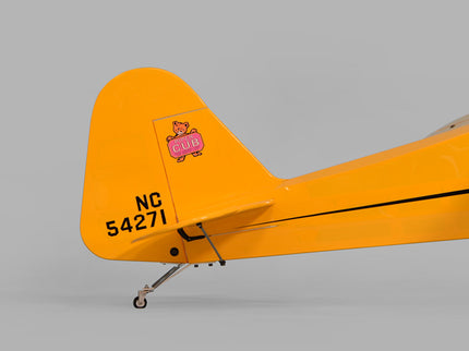 Yellow Phoenix Model PIPER J3 CUB  airplane with a visible logo on the tail against a gray background