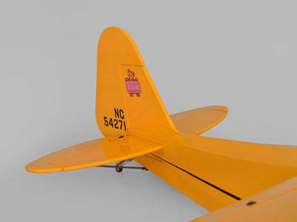 Yellow Phoenix Model PIPER J3 CUB  airplane wing with registration number on a gray background