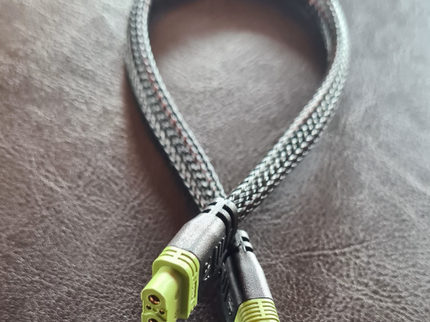 AR1 Extension, Braided cable with green connectors on a textured surface