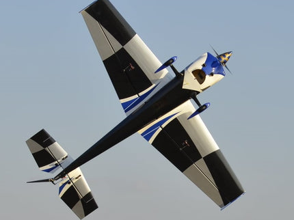 Stunt plane performing aerial maneuvers against a clear sky