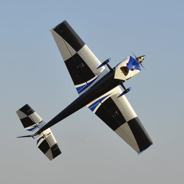 Stunt plane performing aerial maneuvers against a clear sky