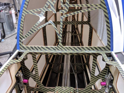 Carbon fiber frame with a checkered pattern on a blurred background